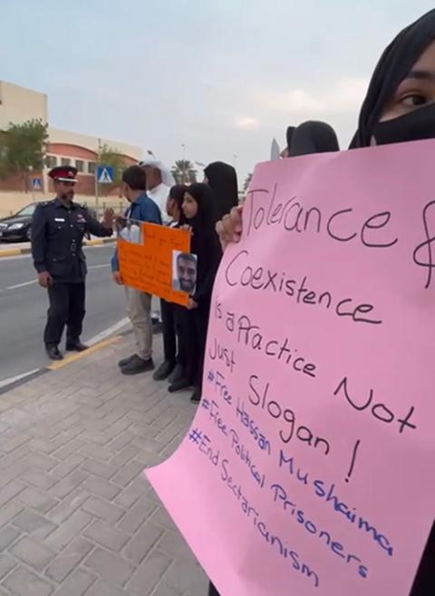 During Pope Francis' visit to Bahrain, Zainab Ibrahim protests the imprisonment and death penalty conviction of her husband, Mohammed Ramadhan, on Nov. 5. (Courtesy of Bahrain Institute for Rights and Democracy/Sayed Ahmed AlWadaei)