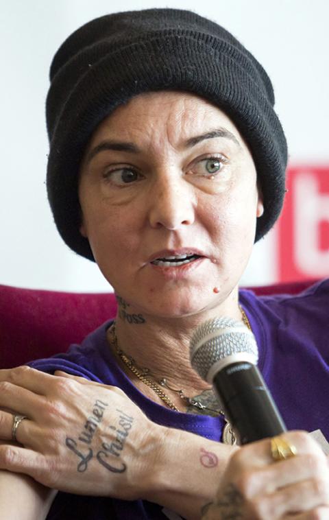 Sinead O'Connor is seen with a tattoo reading "Lumen Christi" in 2015. (MTI via AP/Balazs Mohai)