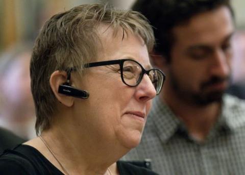 Helen Osman, president of Signis, the World Catholic Association for Communication, listens to Pope Francis at an audience with members, consultants and staff of the Dicastery for Communication Nov. 12, 2022. (CNS/Vatican Media)