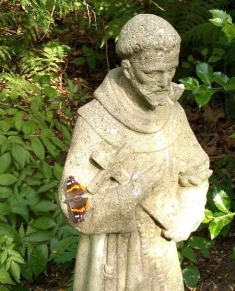 A statue of St. Francis of Assisi stands in Bill Jacob’s yard. (Courtesy of Kat Hoenke)