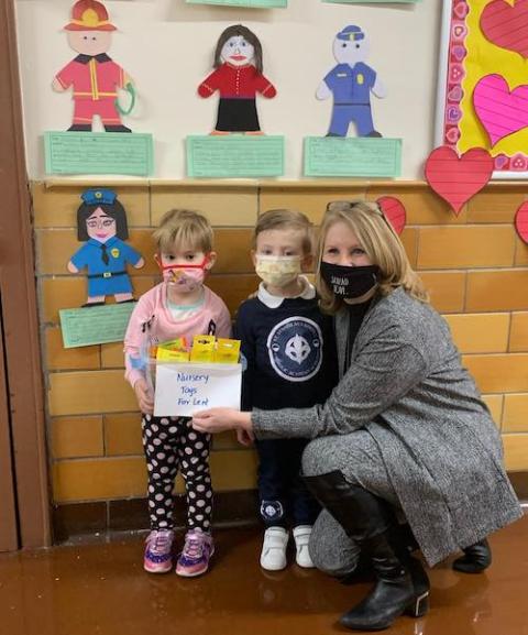 Two students stand with their teacher at St. Stanislaus Kostka Catholic Academy in Queens, New York. (Courtesy of the Brooklyn Diocese)