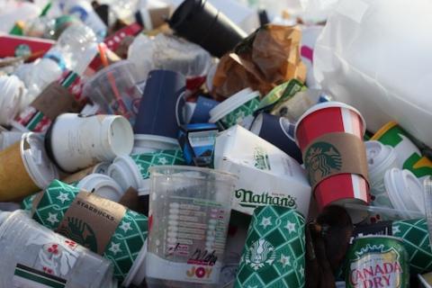 Pile of discarded single use containers, mostly coffee cups