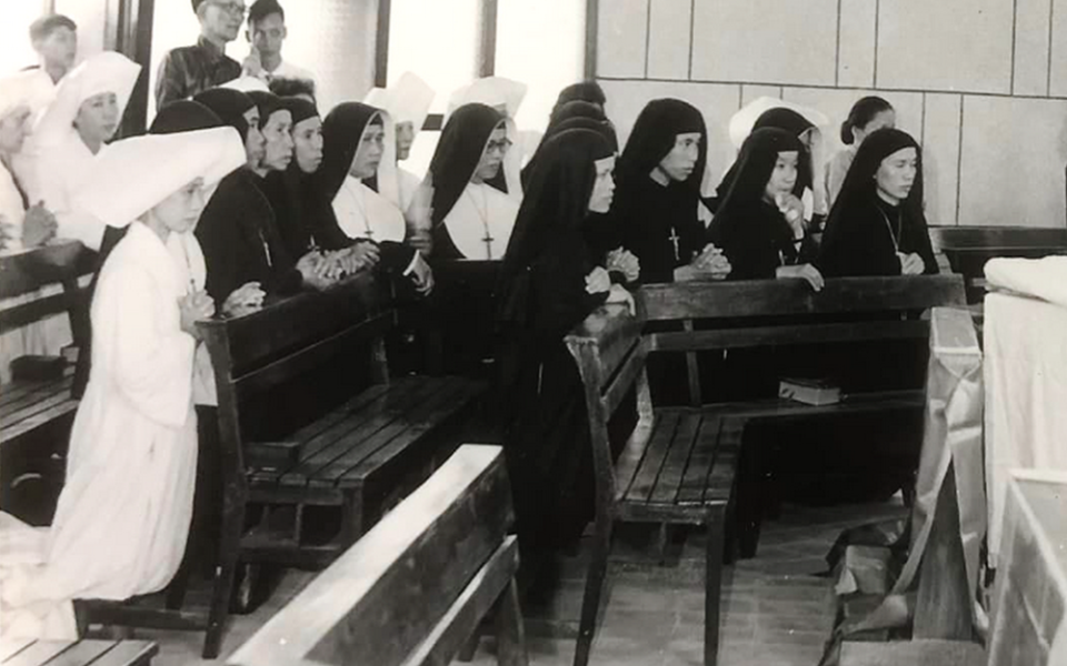 St. Paul de Chartres sisters are pictured praying in their convent in June 1954, in what is today Vietnam's Thanh Hoa Diocese, before they migrated to the south. (Courtesy of Sisters of St. Paul de Chartes)