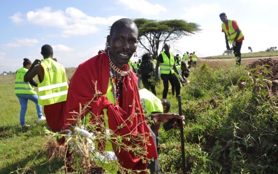 Amos Kwaite, a member of the Maasai community, joins Kenyans including members of the Laudato Si' Movement in a cleanup of Nairobi National Park June 4, World Environment Day. (CNS/Fredrick Nzwili)