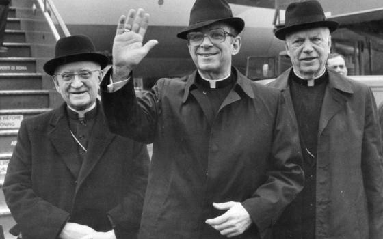 Cardinal Joseph L. Bernardin, archbishop of Chicago, waves upon arriving at Rome's Leonardo Da Vinci airport in this Jan. 30, 1983, file photo. In December 1983 he delivered a lecture outlining a "consistent ethic of life." (AP/Massimo Sambucetti)