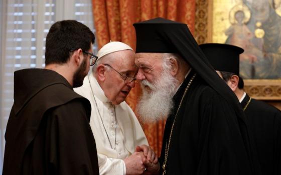 Pope Francis talks with Orthodox Archbishop Ieronymos II of Athens and all Greece during a meeting with their delegations in the Throne Room of the archbishopric in Athens, Greece, Dec. 4, 2021. (CNS photo/Paul Haring)