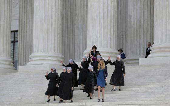 Members of the Little Sisters of the Poor and other women walk down the steps of the U.S. Supreme Court in Washington in March 2016 after attending oral arguments in the Zubik v. Burwell contraceptive mandate case. (CNS/Reuters/Joshua Roberts)