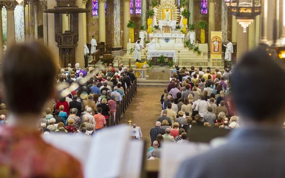 People pray during Mass April 17, 2016, at Holy Redeemer Church in Detroit. The Mass was the site of a "Mass Mob" event, an evangelization effort aimed at boosting regular Mass attendance. (CNS/Jim West)