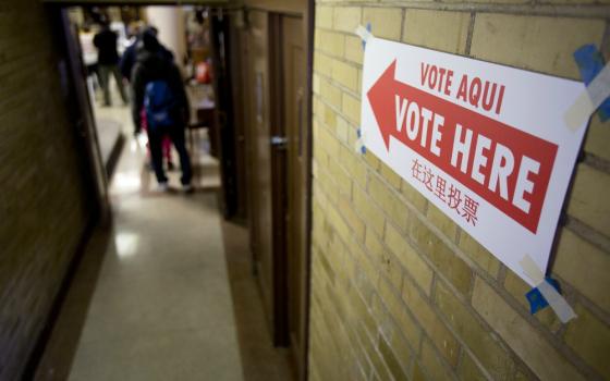 Voters enter the John Bailey Room at St. Francis Xavier Church in Washington Nov. 8, 2016. (CNS/Tyler Orsburn)