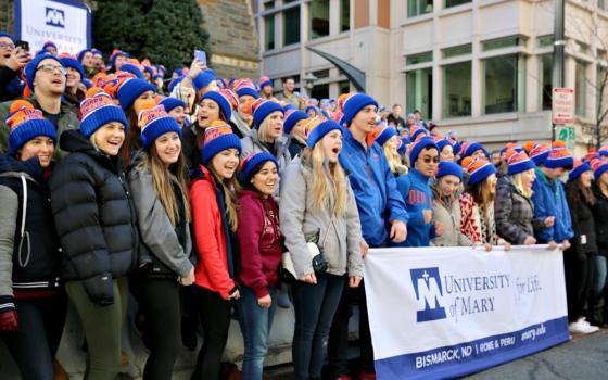 Students from the University of Mary in Bismarck, North Dakota, chant pro-life cheers Jan. 27, 2017, outside of St. Patrick's Catholic Church in Washington, D.C., as they prepare to participate in that year's March for Life. (CNS/Chaz Muth)