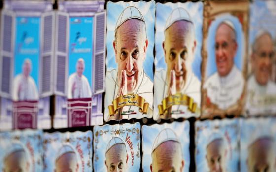 Magnets depicting Pope Francis are seen Aug. 3 at a street vendor's souvenir stand in downtown Rome. (CNS/Reuters/Max Rossi)