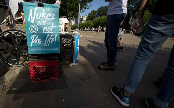 A nuclear war protester demonstrates outside the White House in Washington in 2017. (CNS/Tyler Orsburn)