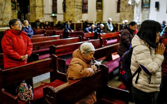 People pray during morning Mass Jan. 30 in the Cathedral of the Immaculate Conception in Beijing. (CNS/EPA/Roman Pilipey) 