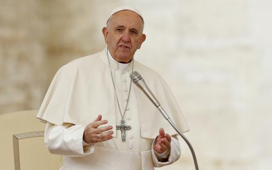 Pope Francis leads a prayer during his general audience in St. Peter's Square at the Vatican April 11. (CNS/Paul Haring) 