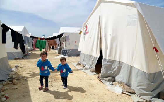 Children, survivors of the April 11 suspected gas attack in Syria, are seen in northern Aleppo April 17. (CNS/Reuters/Mahmoud Hassano)