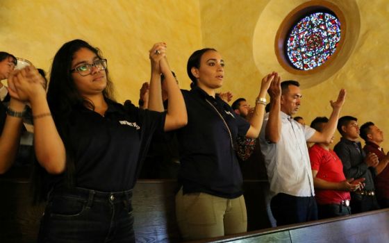 Participants recite the Lord's Prayer during Mass at the Labor Day Encuentro gathering at Immaculate Conception Seminary in Huntington, New York, Sept. 3, 2018. (CNS/Long Island Catholic/Gregory A. Shemitz)