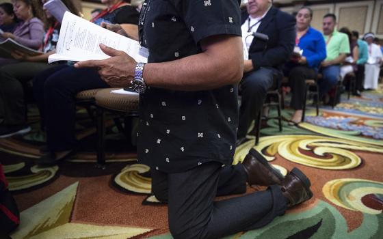 A delegate prays Sept. 23, 2018, during the Fifth National Encuentro in Grapevine, Texas. (CNS/Tyler Orsburn)