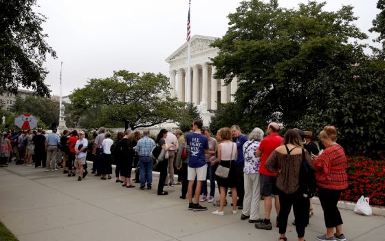 People wait in line to view court proceedings on the first day with newly sworn-in U.S. Supreme Court Justice Brett Kavanaugh Oct. 9 in Washington. (CNS/Reuters/Joshua Roberts)