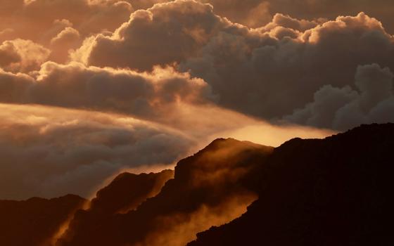 Light illuminates a crater during the sunrise at Haleakala National Park on the Hawaiian island of Maui Oct. 9, 2018. (CNS/Navesh Chitrakar, Reuters)