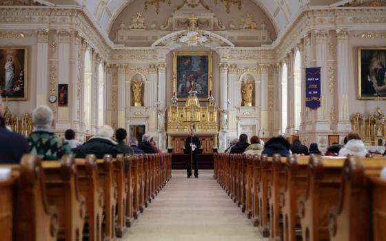 Parishioners from Saint-Charles-Borromée gather inside their 19th-century church in Quebec in 2016. A third of Canada's Christian architecture, some 9,000 churches, will close in the next 10 years, according to the National Trust for Canada. (CNS/Reuters)