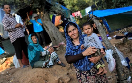 Migrants from Afghanistan are seen at a makeshift camp for refugees and migrants in Samos, Greece, June 25. (CNS/Reuters/Giorgos Moutafis)