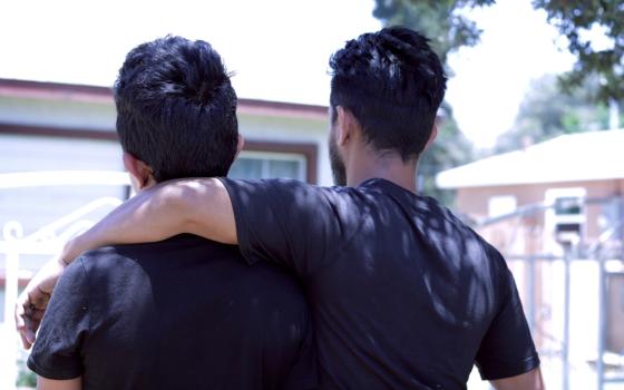 "Carlos" and "Enrique" pose for a photo June 12 in Riverside, Calif. The father and son left Guatemala in 2018 because of police corruption and were separated for more than two months upon arrival to the United States. (CNS/Angelus News/Pilar Marrero)