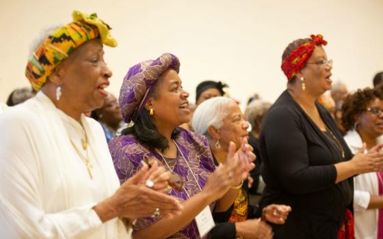 Participants at the Archbishop Lyke Conference sing together during the gathering's closing Mass July 6, 2019, in National Harbor, Maryland. (CNS/Catholic Standard/Andrew Rozario)