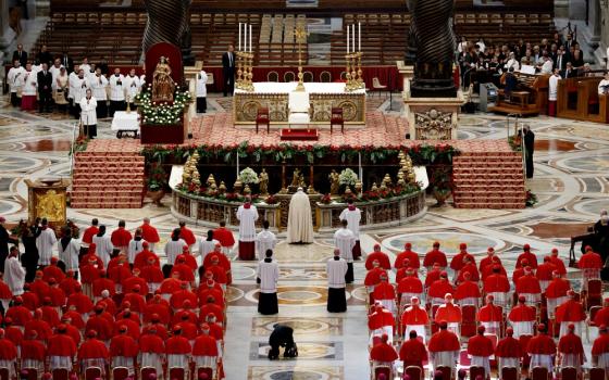 Pope Francis prays as he arrives for a consistory to create new cardinals in St. Peter's Basilica at the Vatican in June 2017. (CNS/Paul Haring)