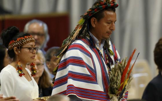 Indigenous people carry offertory gifts as Pope Francis celebrates the concluding Mass of the Synod of Bishops for the Amazon at the Vatican Oct. 27, 2019. (CNS/Paul Haring)