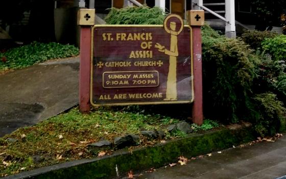 A sign welcomes all to St. Francis of Assisi Church in Portland, Oregon. (Peter Feuerherd)