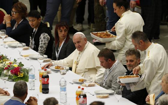 Pope Francis eats lunch with the poor in the Paul VI hall as he marks World Day of the Poor Nov. 17, 2019, at the Vatican. (CNS/Paul Haring)