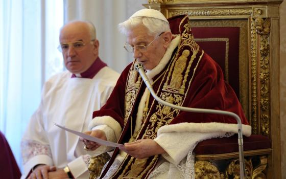 Pope Benedict XVI reads his resignation in Latin during a meeting of cardinals at the Vatican on Feb. 11, 2013. (CNS/L'Osservatore Romano)