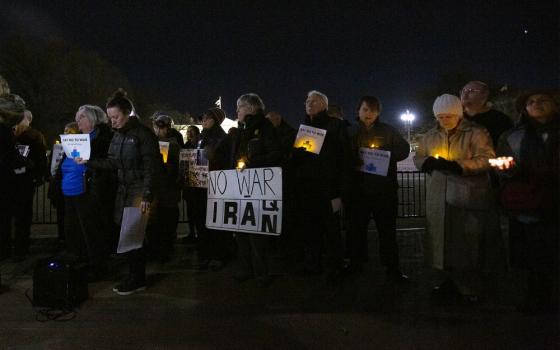 People gather Jan. 6 near the White House in Washington during a candlelight vigil to call for peaceful solutions to rising tensions between the United States and Iran. (CNS/Tyler Orsburn)