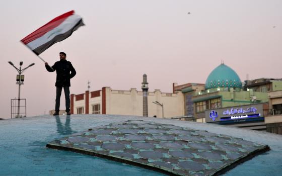 A man celebrates in Tehran, Iran, Jan. 8 after the country launched missiles at U.S.-led forces in Iraq. (CNS/West Asia News Agency via Reuters/Nazanin Tabatabaee) 