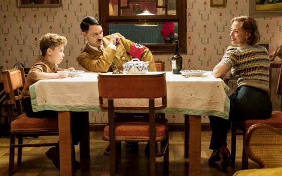 Roman Griffin Davis, Taika Waititi and Scarlett Johansson are seen in the movie "Jojo Rabbit." (CNS/Fox Searchlight)