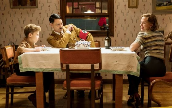 Roman Griffin Davis, Taika Waititi and Scarlett Johansson are seen in the movie "Jojo Rabbit." (CNS/Fox Searchlight)