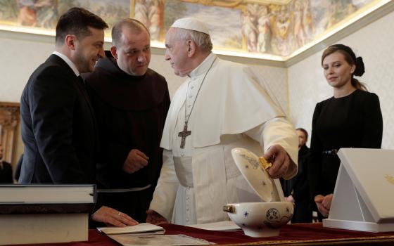 Pope Francis exchanges gifts with Ukrainian President Volodymyr Zelensky during a private audience at the Vatican Feb. 8, 2020. (CNS/Gregorio Borgia, pool via Reuters)