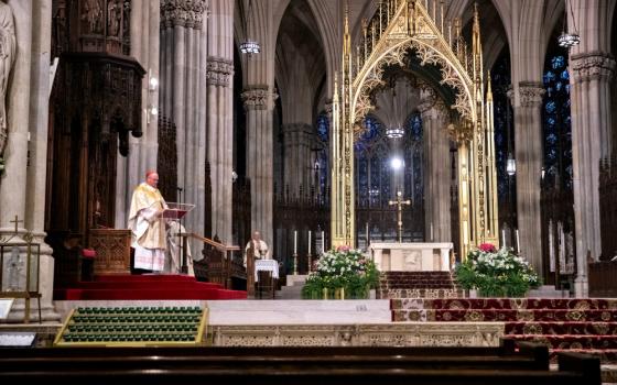 New York Cardinal Timothy Dolan celebrates Easter Mass at St. Patrick's Cathedral April 12 during the coronavirus pandemic. (CNS/Reuters/Jeenah Moon)