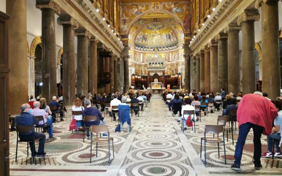 People are seen inside Rome's Basilica of Santa Maria in Trastevere June 5, 2020, before a prayer vigil for peaceful coexistence in the United States. (CNS/Junno Arocho Esteves)