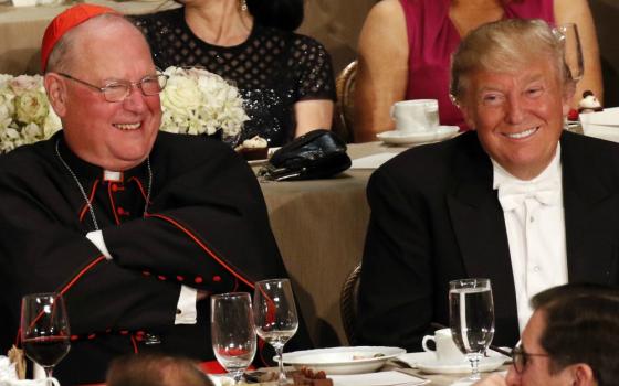 Cardinal Timothy Dolan and Donald Trump, then the Republican nominee for president, smile during the Alfred E. Smith Memorial Foundation Dinner in New York City Oct. 20, 2016. (CNS/Gregory A. Shemitz)