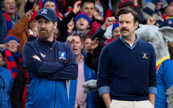 Jason Sudeikis, right, appears with Brendan Hunt in a scene from the TV show "Ted Lasso" streaming on Apple TV+. (CNS/Apple TV )