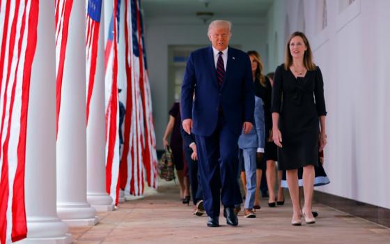 President Donald Trump arrives at the White House Rose Garden with federal Judge Amy Coney Barrett Sept. 26 to nominate her to fill the U.S. Supreme Court vacancy. (CNS/Reuters/Carlos Barria)