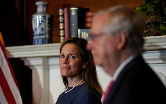 Judge Amy Coney Barrett, President Donald Trump's nominee for the U.S. Supreme Court, meets with Senate Majority Leader Mitch McConnell, R-Kentucky, on Capitol Hill in Washington Sept. 29. (CNS/Susan Walsh, Pool via Reuters)