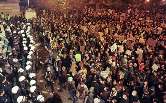 Demonstrators protest Oct. 25, 2020, in front of the Cathedral of Christ the King in Katowice, Poland, against the ruling by Poland's Constitutional Tribunal that imposes a near-total ban on abortion. Many young Polish women protested in November against 