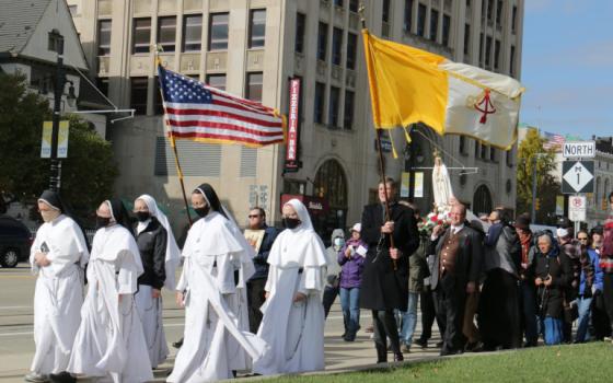 Women religious and other Catholics in Detroit march during a Unite Our Nation procession Oct. 31. (CNS/Detroit Catholic/Dan Meloy)