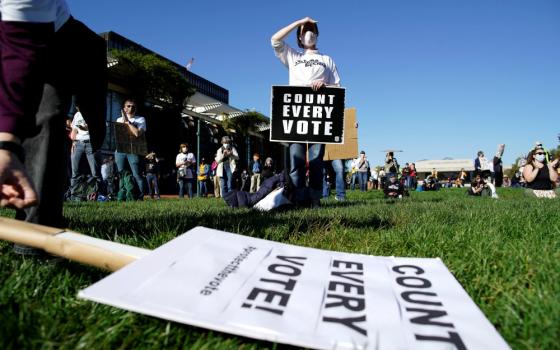 A woman holds a sign during a rally demanding a fair count of the votes of the presidential election in Philadelphia Nov. 4. (CNS/Reuters/Eduardo Munoz)