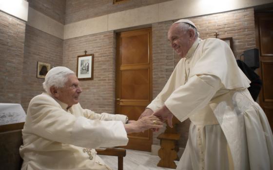 Pope Francis, right, greets retired Pope Benedict XVI at the retired pope's residence during a visit with new cardinals after a consistory at the Vatican Nov. 28, 2020. (CNS/Vatican Media)