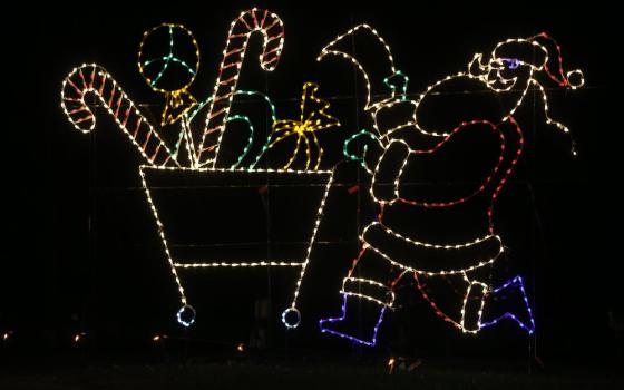 A Santa Claus figure is illuminated in a Christmas lights show at Sandy Point State Park on Maryland's Chesapeake Bay Dec. 12, 2020. (CNS/Bob Roller)