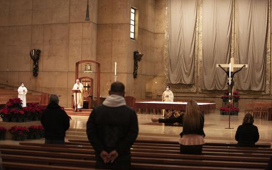 Archbishop José Gomez of Los Angeles, president of the U.S. Conference of Catholic Bishops, celebrates Christmas Eve Mass Dec. 24, 2020, at the Cathedral of Our Lady of the Angels in Los Angeles. (CNS/Victor Alemán, Angelus News)