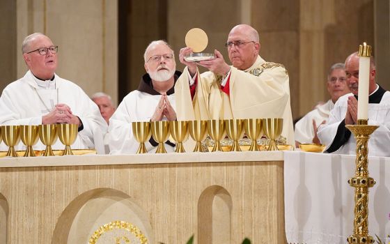 Cardinals Timothy Dolan of New York, left, Sean O'Malley of Boston, and Archbishop Joseph Naumann of Kansas City, Kansas, concelebrate the opening Mass of the National Prayer Vigil for Life Jan. 23, 2020, at the Basilica of the National Shrine of the Imma